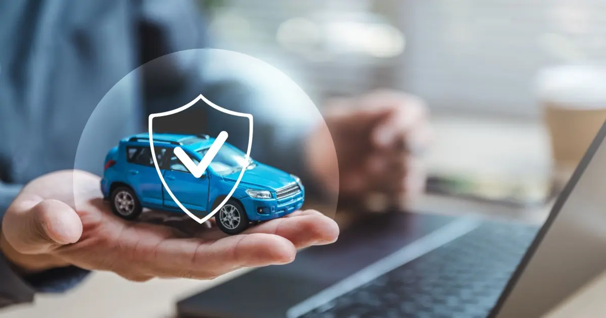 Hand holding digital car insurance protection icon