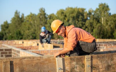 Worker in protective helmet at construction site
