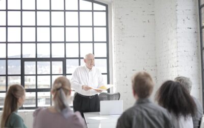 Executive leading boardroom meeting