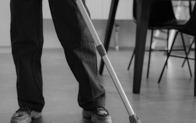 Professional cleaner mopping commercial floor